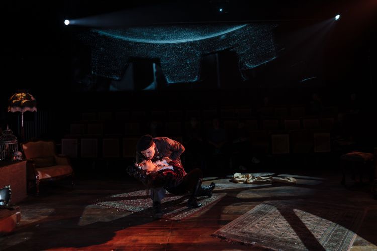 Opera singers perform surrounded by video projections